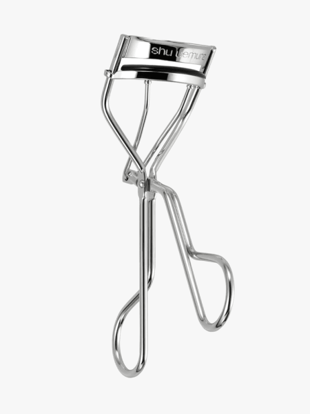 Shu Uemura Iconic Eyelash Curler in branded component on a light gray background