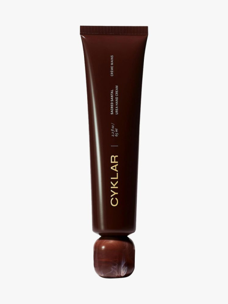 Cyklar Urea Hand Cream in Sacred Santal brown tube on light gray background